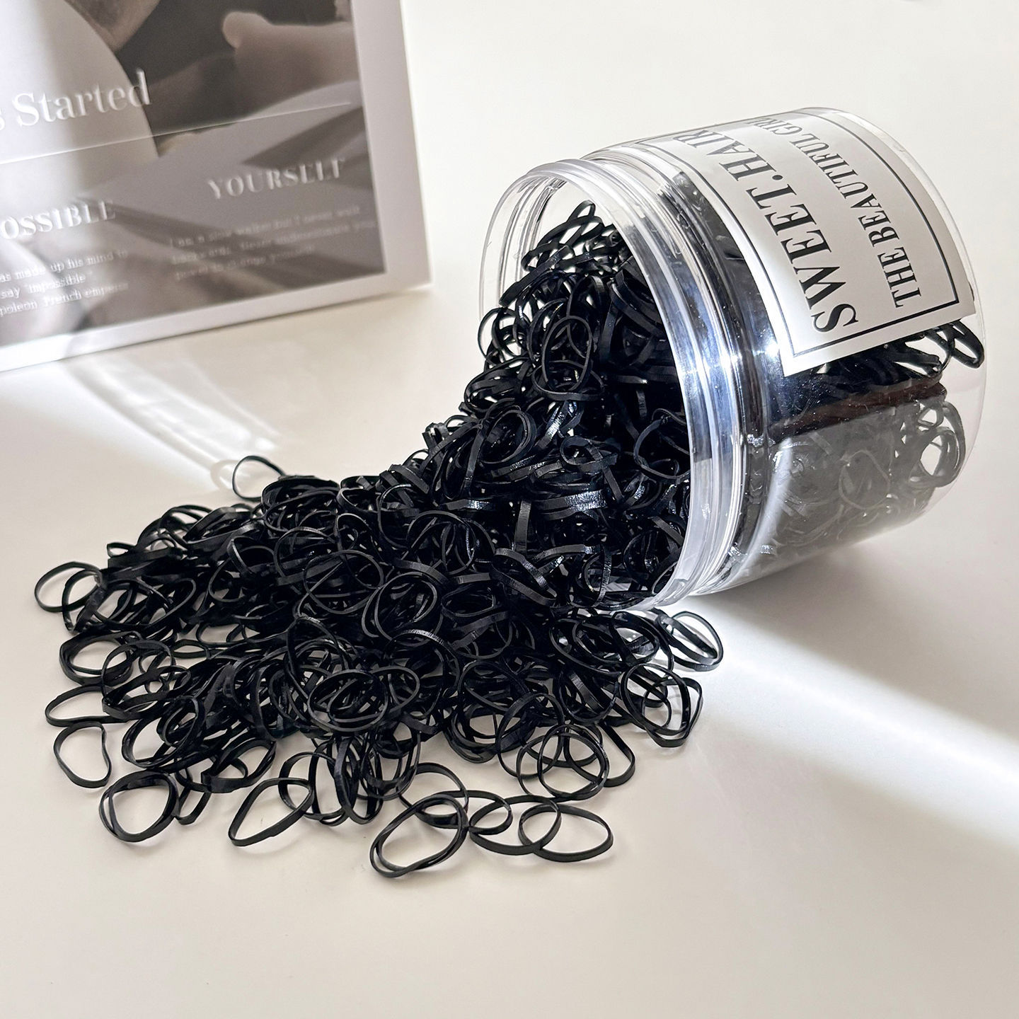 Anillo de cabello para niños de alta elasticidad desechable banda de goma 300 enlatada al por mayor