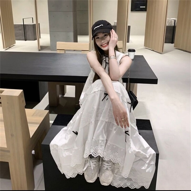 Two-Piece Set for a Lazy, Relaxed Look. a Complete Outfit with a Bow-Tie Design, Sleeveless Shirt Paired with a Long Skirt