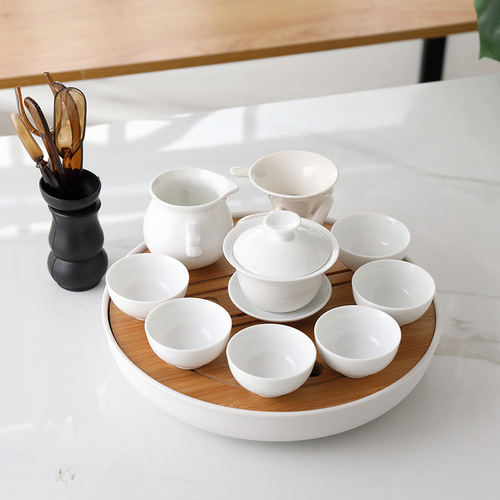 A complete set of white ceramic Chaoshan Gongfu tea set for home use, high-temperature resistant, simple Chinese style, including teapot, lid, and cups