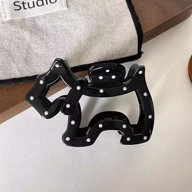 Black polka dot puppy