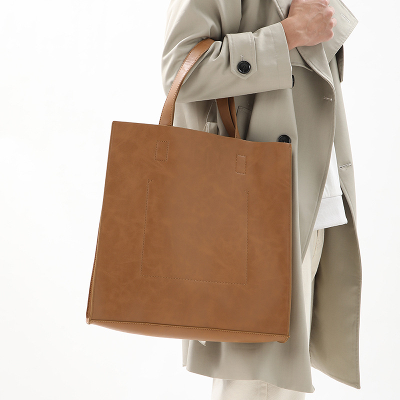 Korean version of fashionable PU leather shoulder bag, simple commuter men's and women's tote bag, square vertical crossbody large-capacity handbag_voghion.com