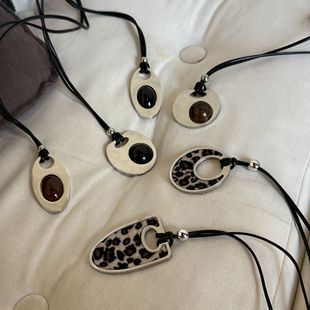 South Korea blogger with titanium steel leopard resin personality geometric design sense sweater chain long versatile black rope necklace