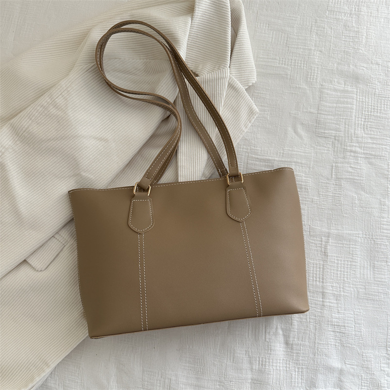 Bolso de viaje de alta gama retro 2025 primavera nuevo estilo salvaje ins color sólido bolso de hombro de trabajo bolso Tote