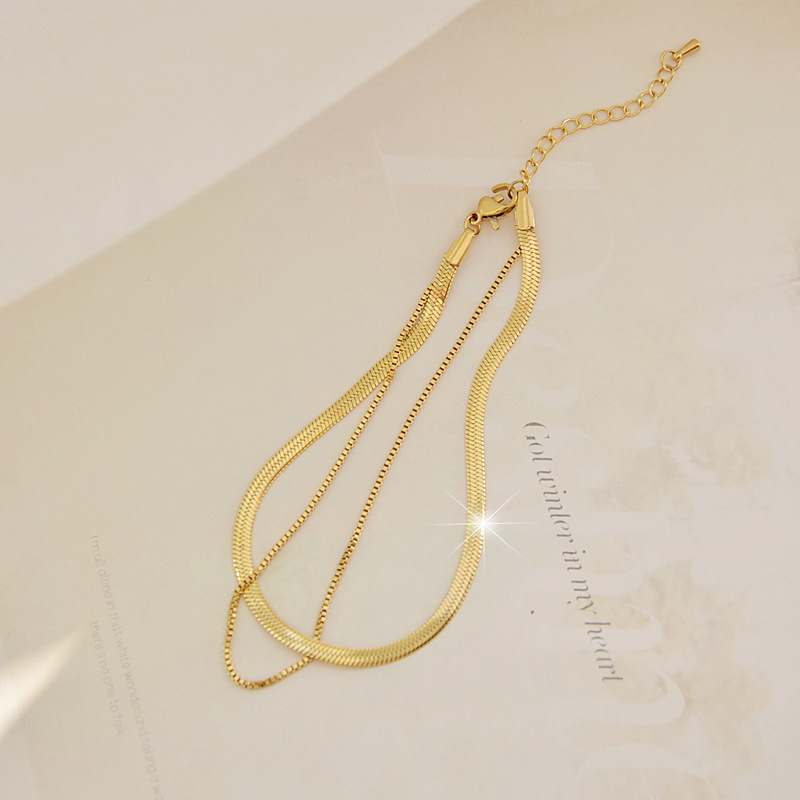 Wen Jian 18 quilates de hueso de serpiente de acero de titanio dorado tobillera de doble capa femenino frío viento bosque simple celebridad de Internet pies de moda