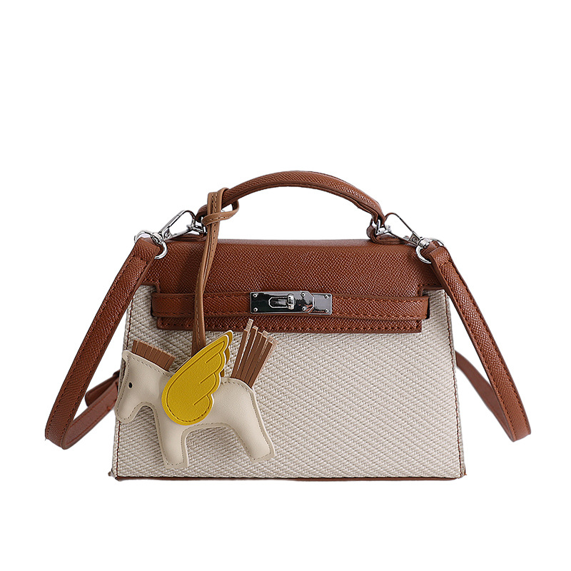 Textura de nicho bolso de diseño de mujer 2026 nuevo bolso Kylie color contraste diario simple viaje mochila de hombro