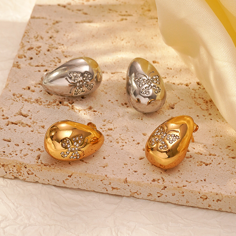 La tendencia de moda europea y americana atmosférica de acero inoxidable gota de agua mosaico de mariposa estriado pendientes de zircón para mujeres chapado 18K pendientes