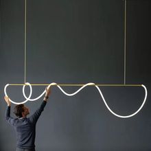 北歐極簡長條餐廳吊燈現代簡約輕奢設計師創意藝術纏繞音符吧台燈