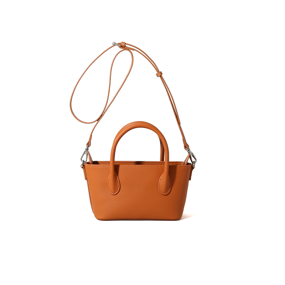 Bolso retro de gran capacidad para mujeres 2025 primavera nueva moda textura bolso de mano bolso de hombro de viaje universal