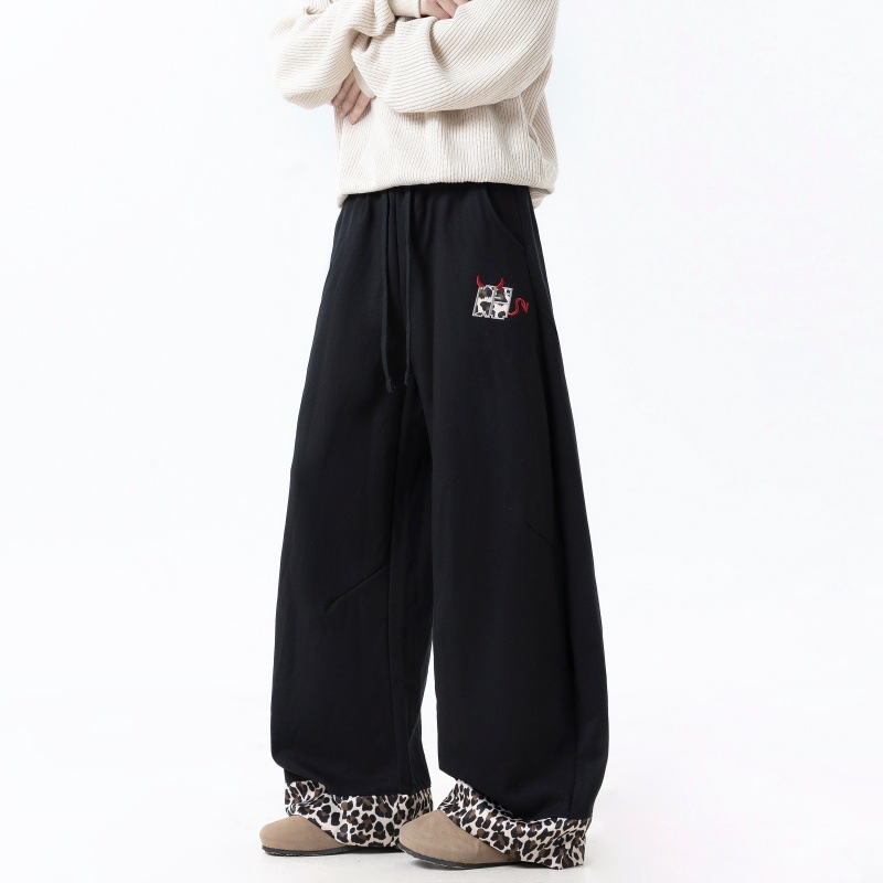 Pantalones casuales para hombres primavera y otoño de 2025 pantalones sueltos de piernas anchas de leopardo para hombres pantalones deportivos de tendencia para hombres