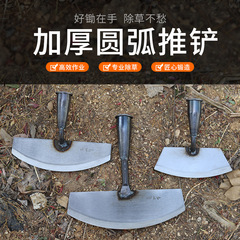 Grave-tending in the moon-crescent vegetable garden, using a hand hoe to weed, solid wood-handled garden tool, clearing the land, hoeing and pushing weeds, cultivating the soil with a hoe