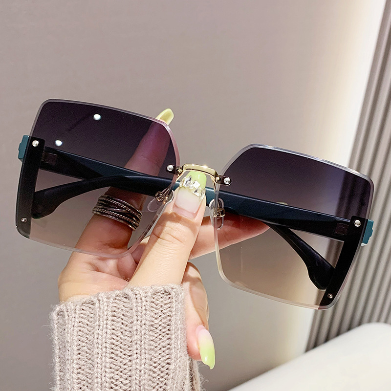 Nuevas gafas de sol de moda de alta calidad sin marco de borde de corte de las mujeres gafas de sol de gran marco a prueba de rayos UV gafas de sol de moda