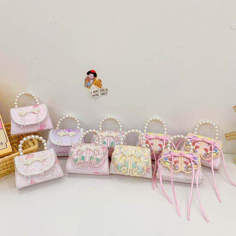 Mochila de moda para niñas, bolso de perla de arco dulce, bolso de mano de 2025 nuevo bolso de cadena para niños