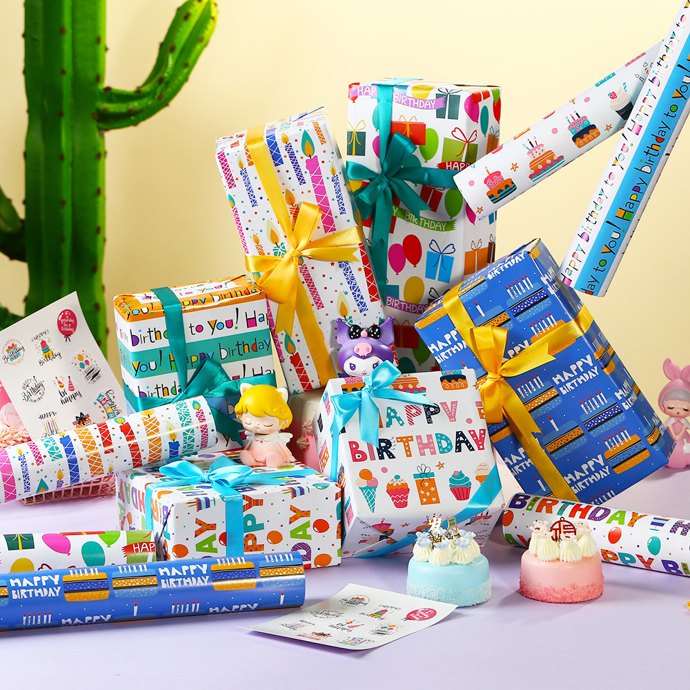 Nuevo papel recubierto creativo papel de embalaje de impresión globo de cumpleaños pastel vela papel de regalo de dibujos animados al por mayor