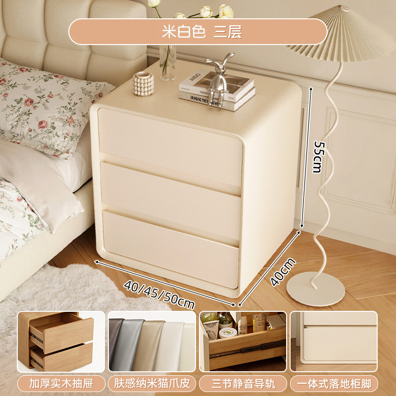 Mesa de cabezal de cama de madera maciza dormitorio doméstico 2025 nuevo estilo de cama pequeño viento de crema de lujo ligero alta sensación gabinete de almacenamiento
