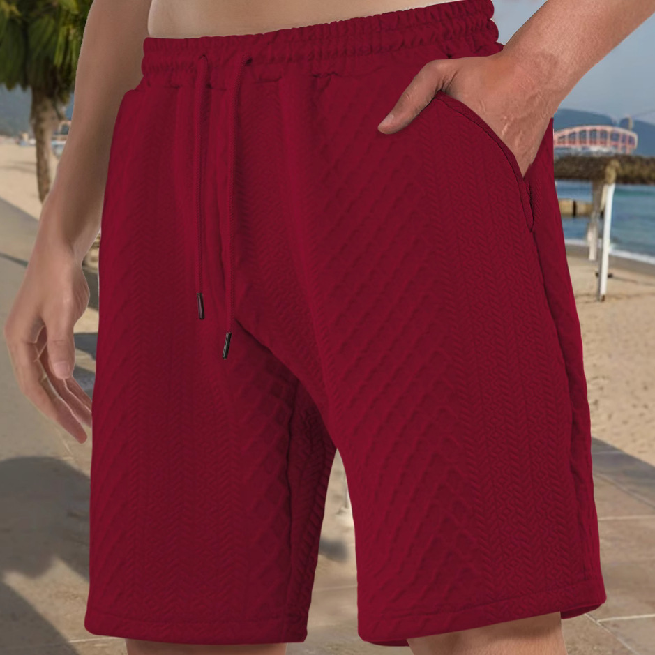 Europa y Estados Unidos ropa de hombre transfronteriza spot verano suelta pantalones cortos de color sólido jacquard correa de hombre casual pantalones cortos de playa