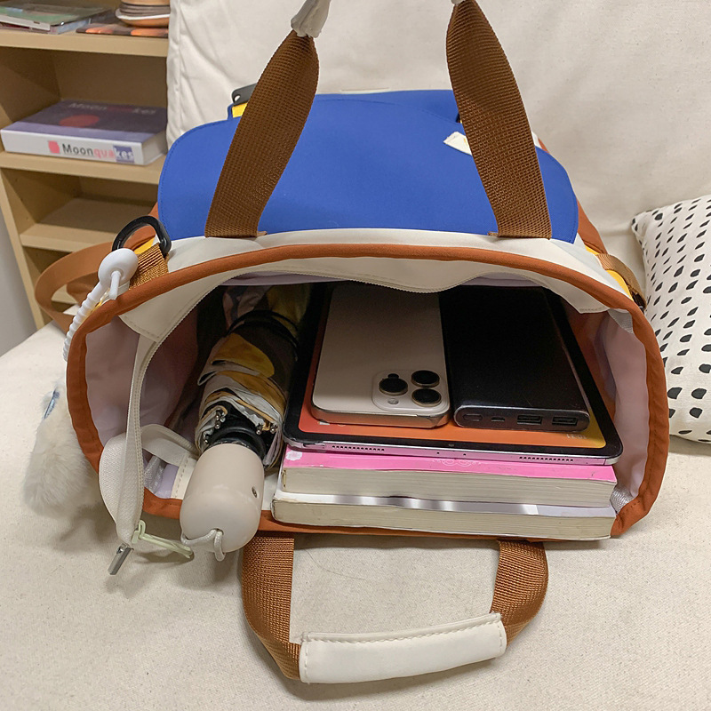 新商品の学院風のリュックサックの男女大衆のデザイン感は色の学生のかばんの潮流にぶつかります。|undefined