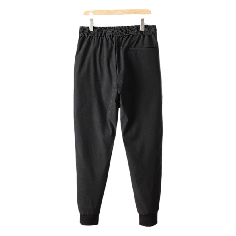 Пара зимних 90-х зимних новых мужских повседневных уличных водонепроницаемых брюк на гусином пуху с эластичной резинкой на талии.