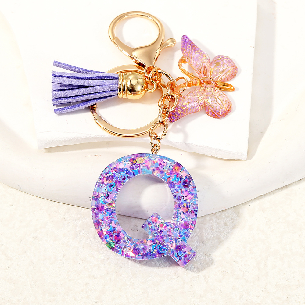 Mayorista transfronterizo mariposa esquinilla iniciales llavero de cristal goteo llavero de letras bolsos colgante