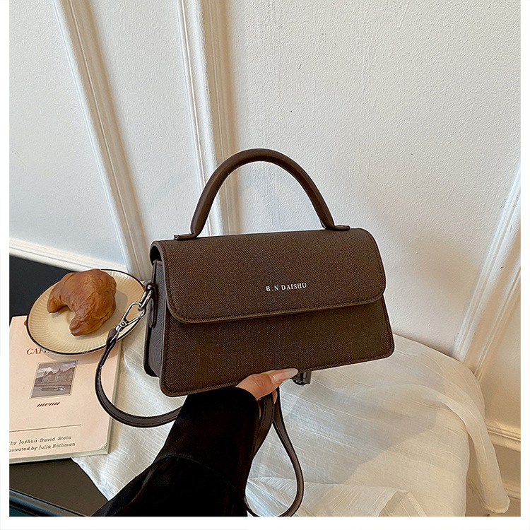 Super nicho coreano de color sólido bolso pequeño 2026 nueva moda femenina verano temperamento simple mochila de hombro