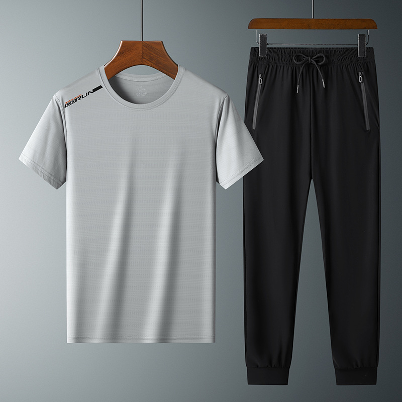 Moda pantalones de seda de hielo cuello redondo Camiseta de dos piezas para hombres talla grande suelta de secado rápido traje deportivo LOGO se puede formular