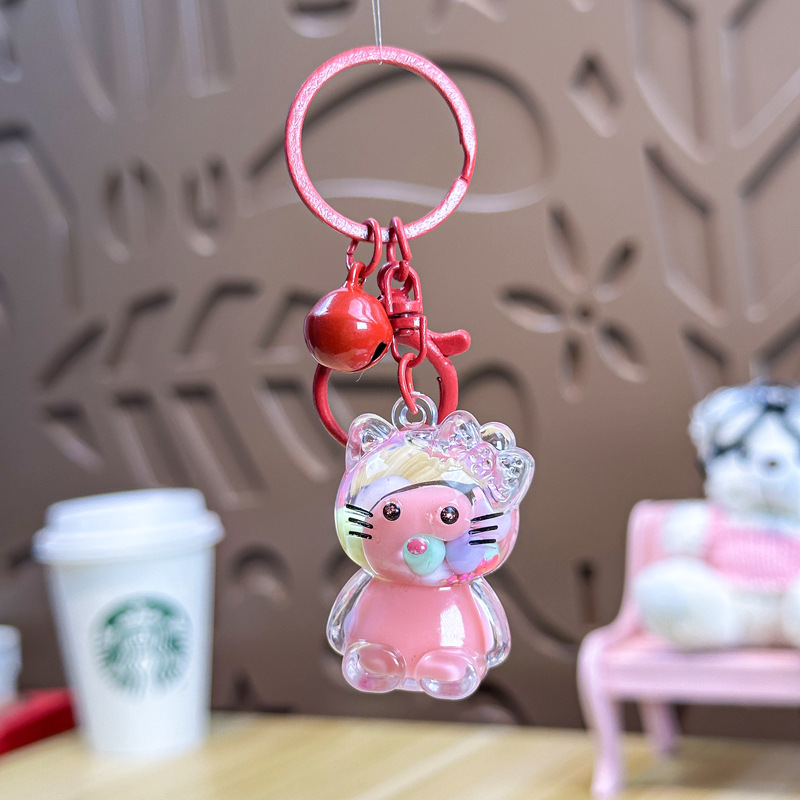 Caricatura en aceite líquido arena flotante botella mochila llavero delicado colgante accesorios accesorios máquina de muñecas pequeños regalos al por mayor