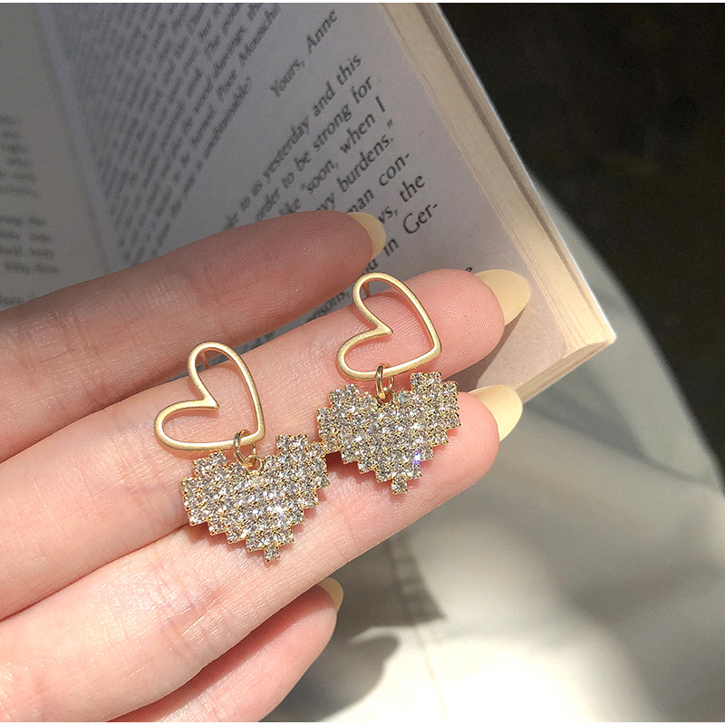 Korean Hollow Double Heart Earrings Wholesale Nihaojewelry display picture 4