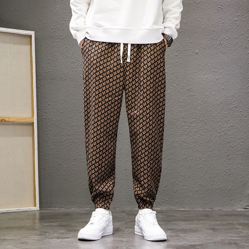New men's printed letter pants, spring and autumn style, trendy slim-fit jogger pants, loose fit, plus size, casual harem pants New men's printed letter pants, spring and autumn style, trendy slim-fit jogger pants, loose fit, plus size, casual harem pants