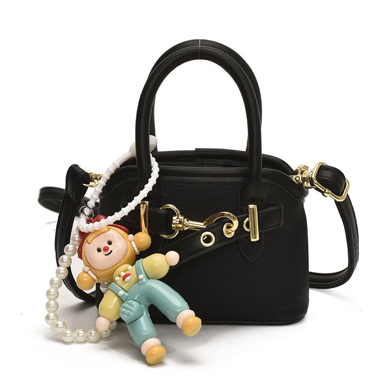 Bolsos de mano para niños lindos colgantes extranjeros mini bolsos de hombro para niños y niñas de color sólido simple bolsos de conchas de niños de moda