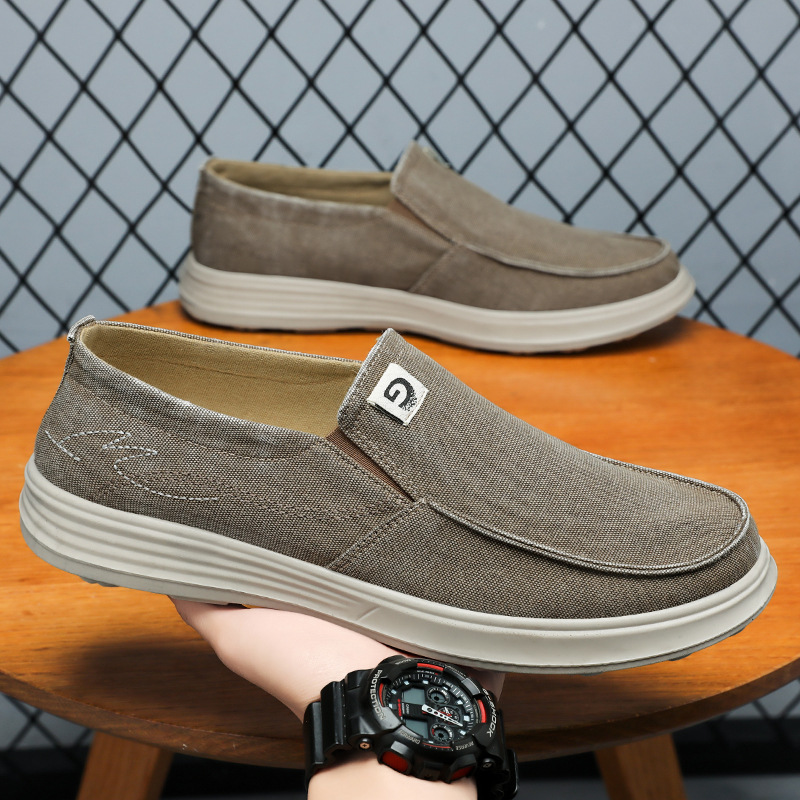 Zapatos para hombres de verano nuevos zapatos de lona al por mayor zapatos casuales de un pedazo de zapatos de trabajo transpirables coreanos viejos zapatos de tela de Beijing
