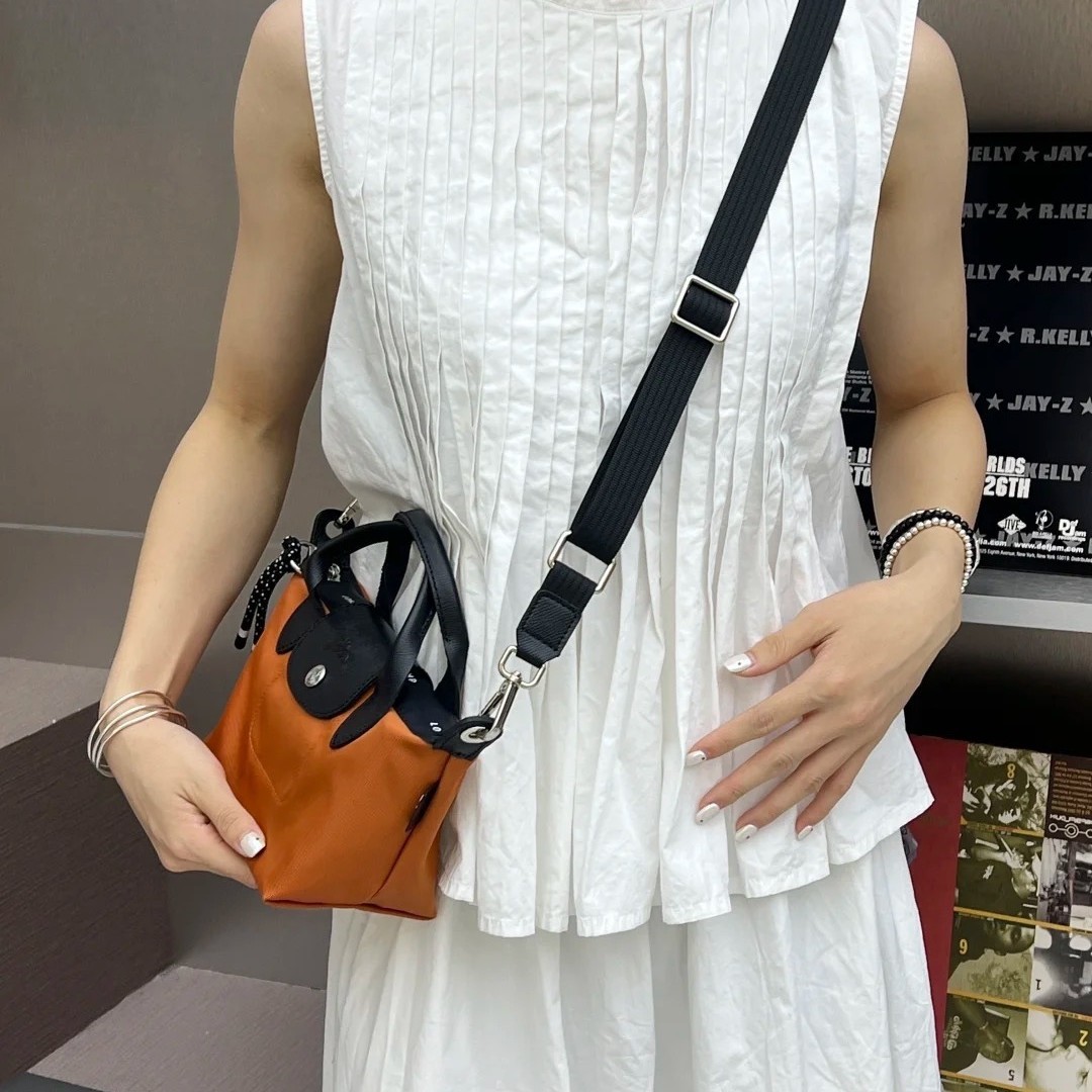 Agencia de distribución transfronteriza, segunda generación de productos de alta calidad, tela reciclada, bolsa de bola de masa, bandolera, bolso de mano