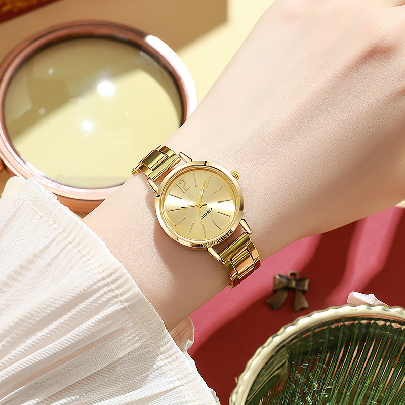 Nueva correa de acero de comercio exterior para mujer, moda simple, redonda, correa de acero pequeña de oro, reloj de cuarzo, reloj de moda para estudiantes de mujer