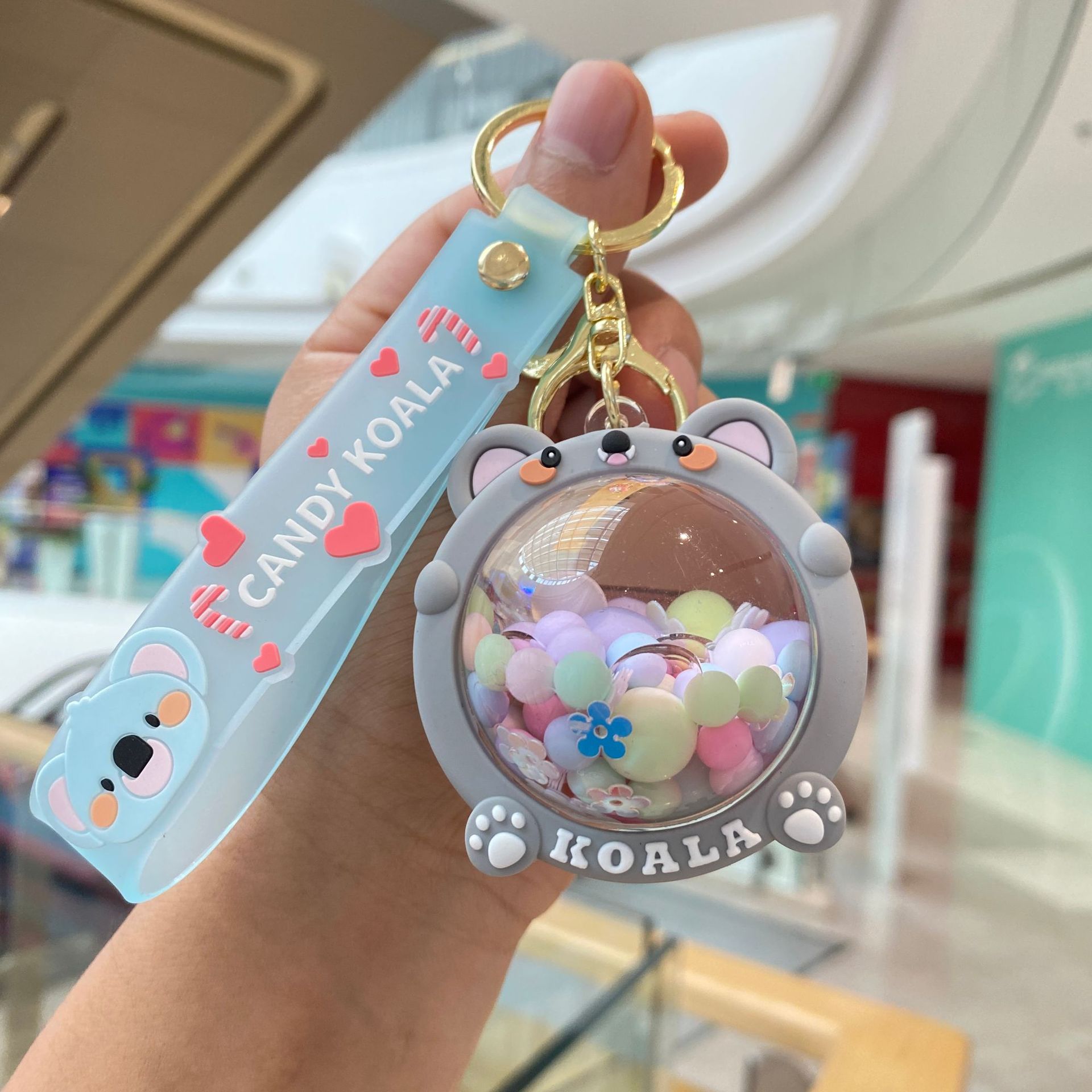 Acrílico lleno de aceite de melocotón llavero pareja bolsa colgante coche llavero lindo pequeño regalo al por mayor