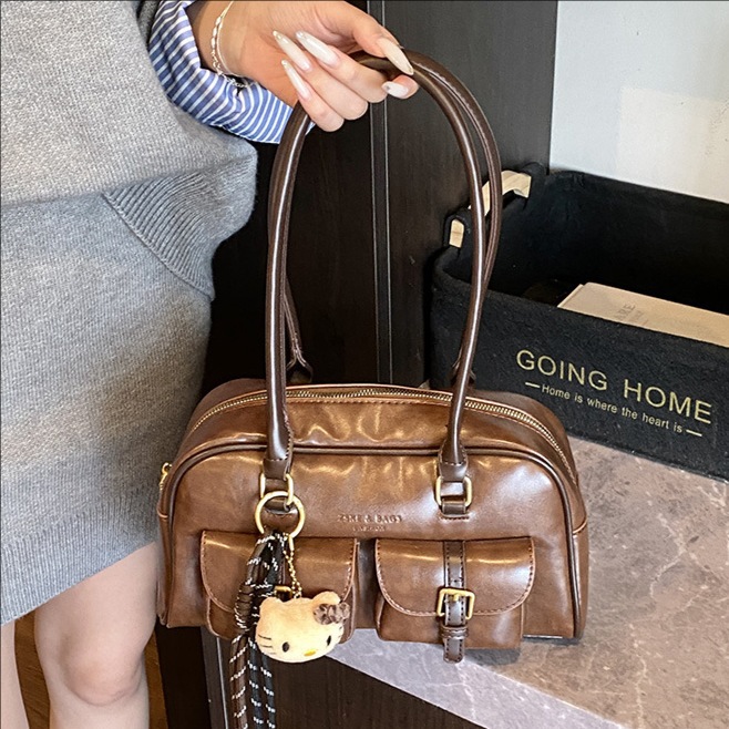 Bolsa de almohada portátil simple coreana transfronteriza para mujeres otoño / invierno 2025 nuevo retro versátil bolso de hombro bolso de brazo de viaje