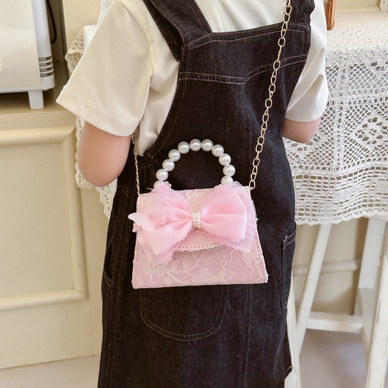 Bonito pequeño viento de la princesa viento bolso de perlas bolso de mano bolso de hombro para niños arco