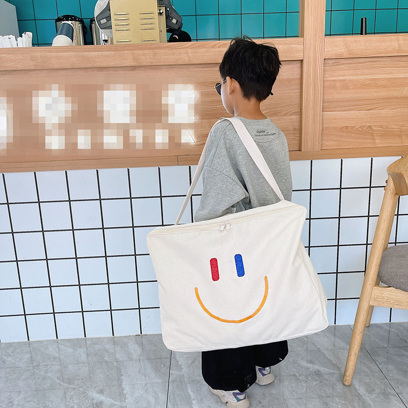 Large Capacity Canvas Travel Bag Korean Children Messenger Bag Smiley Shoulder Bag Kindergarten Quilt Storage Bag Wholesale