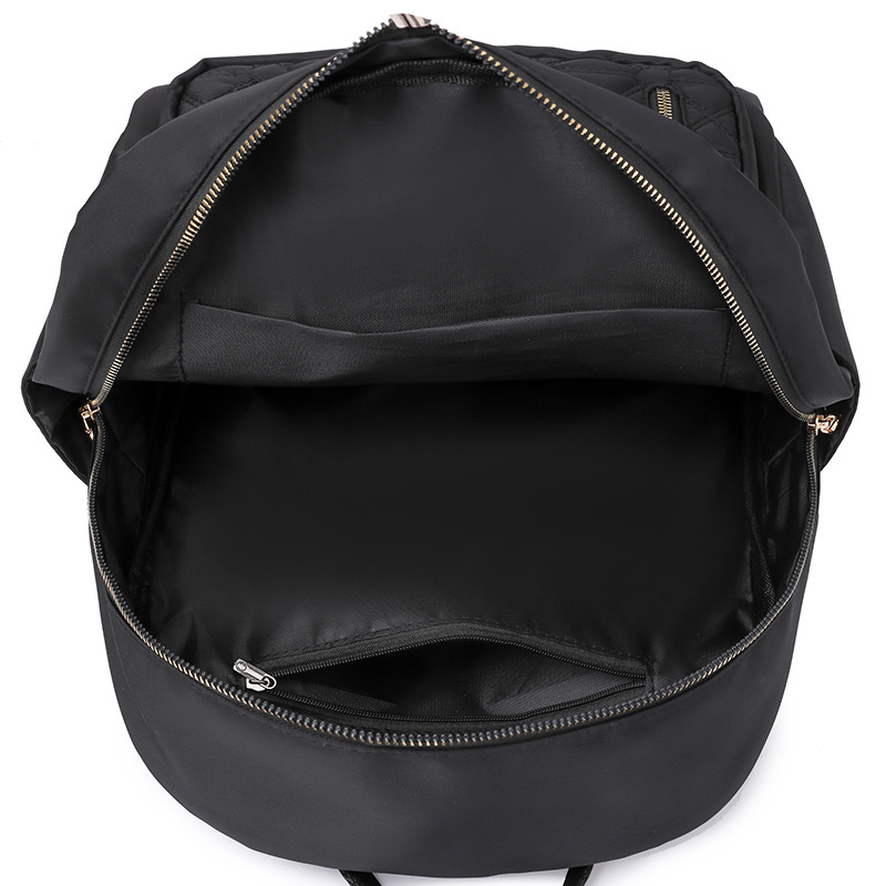 Comercio exterior al por mayor 2023 nueva versión coreana de la mochila de nailon para mujer, línea de bordado de moda, mochila de viaje al aire libre de todo fósforo, marea