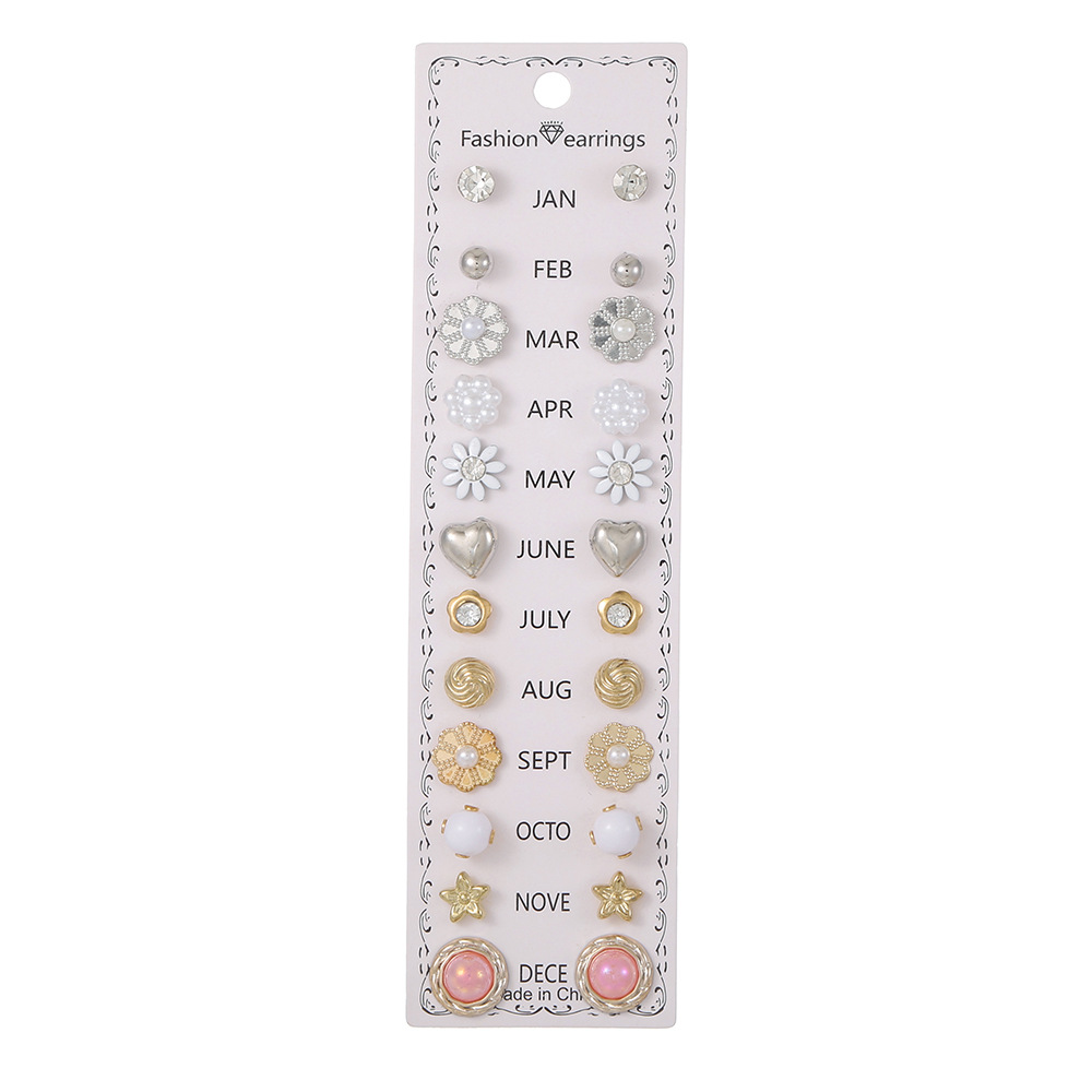 Set de 12 pares de aretes con flores y diamantes