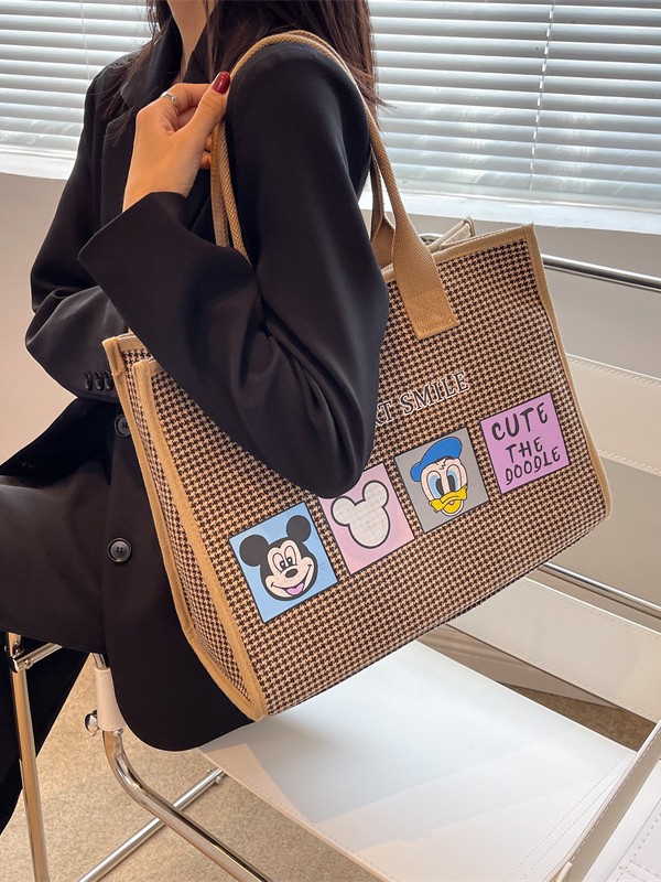 Bolso de mujer de alta sensación 2025 nuevo lienzo simple impresión de gran capacidad bolso de mano bolso de hombro de caricatura mamá