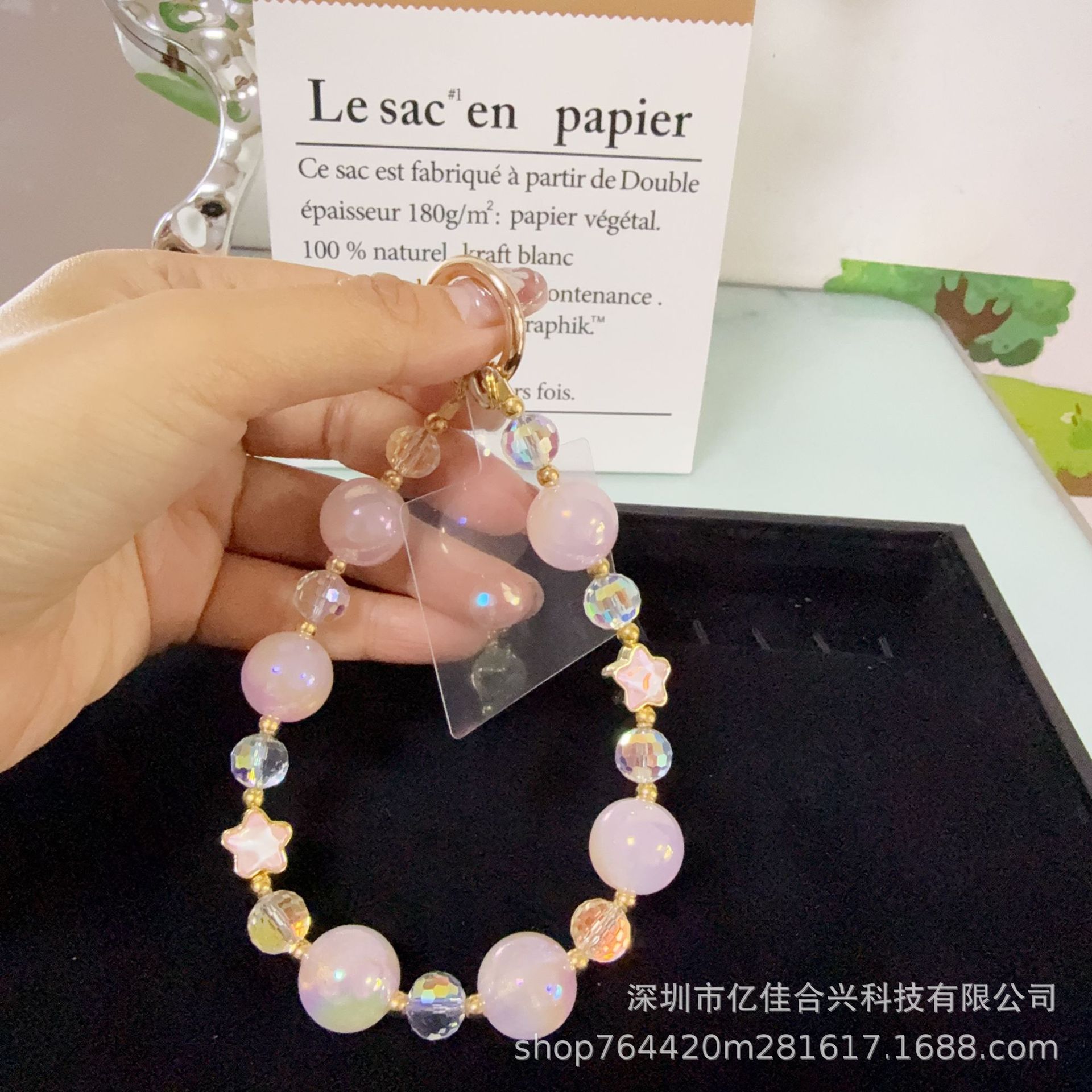 Mayorista cadena de teléfonos móviles sensación de alta calidad estereoscópica bola pentagonal llave colgante perla de teléfono móvil colgante pulsera nuevo