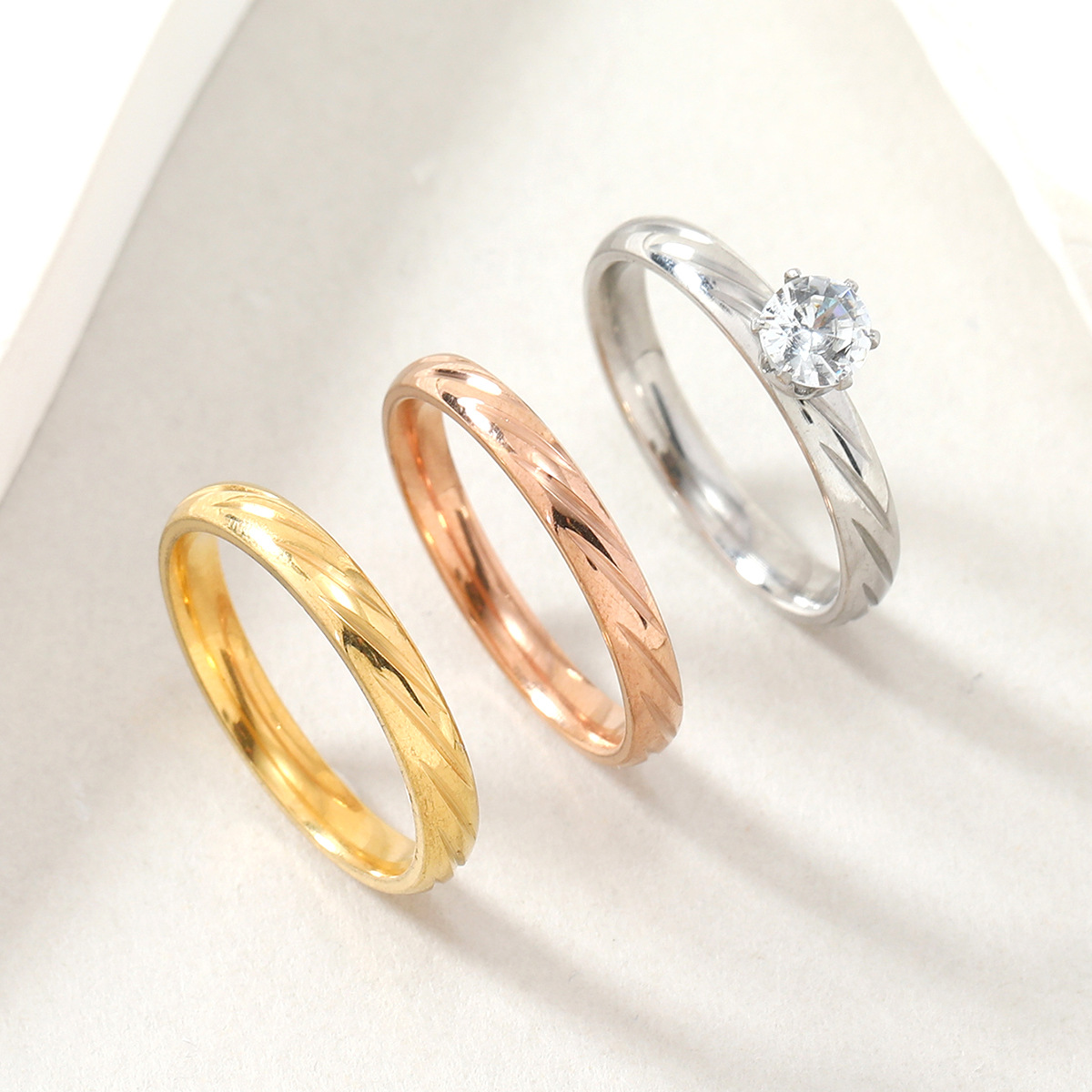 Hot selling titanium jewelry, real gold spherical surface batch flower diagonal inlay with zircon stainless steel couple_voghion.com