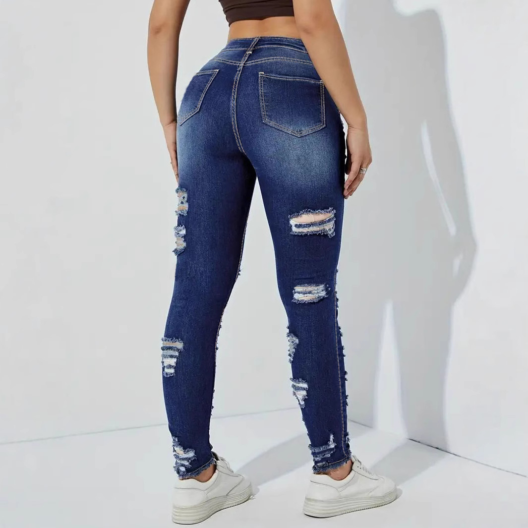 Pantalones de mezclilla de mujer elásticos con bordes sin bordes rotos europeos y americanos transfronterizos
