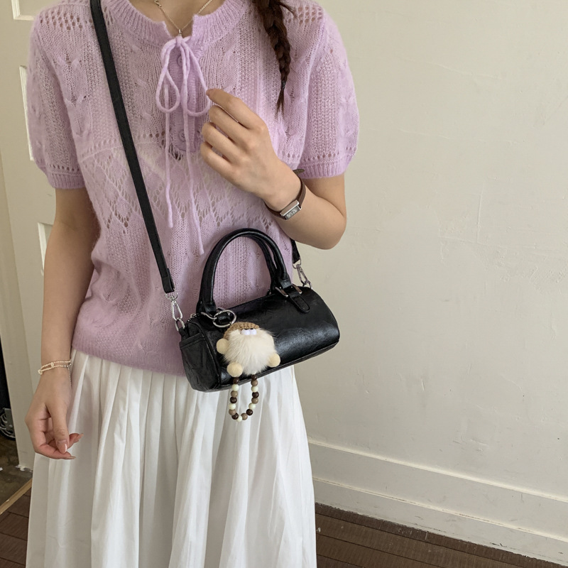 Nicho de diseño retro bolso de mano mujer 2026 primavera nuevo bolso de hombro sensación diaria de moda oblicuo bolso cilíndrico