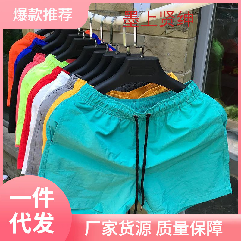 Pantalones cortos pantalones de playa de tendencia casuales sueltos para hombres pantalones medianos pantalones grandes pijamas para hombres pantalones de baño deportivos casuales pantalones grandes