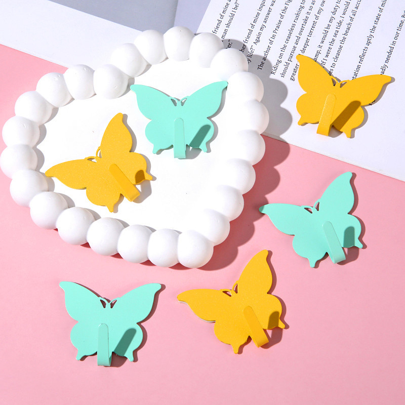 Gancho de mariposa fuerte sin agujeros ins viento encantador gancho adhesivo de corazón de niña decoración de pared de habitación gancho adhesivo de alto valor visual