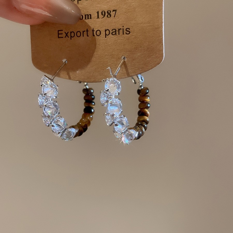 Pendientes de ojo de tigre artificial de color café Maillard con aguja de plata Pendientes simples y de moda de todo fósforo Pendientes ligeros de lujo de alta gama