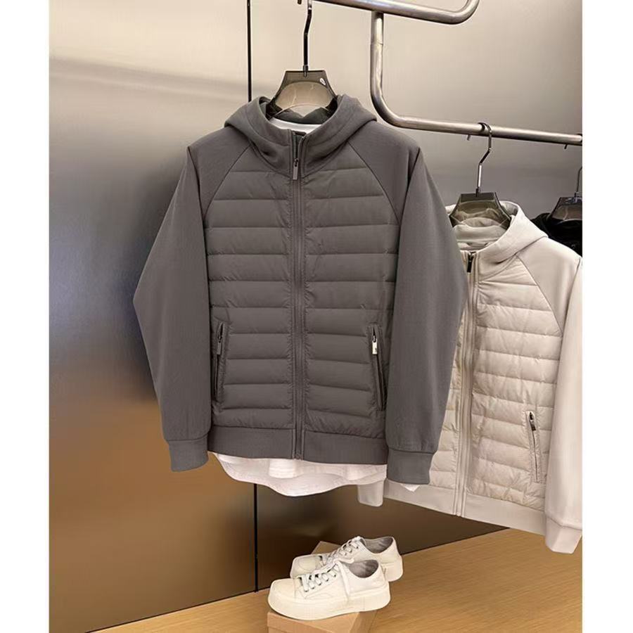 ファッション秋冬2025年帽子付きデザイン感カジュアルな純色の大衆が男性青年の帽子付きコートをつなぎ合わせて保温する