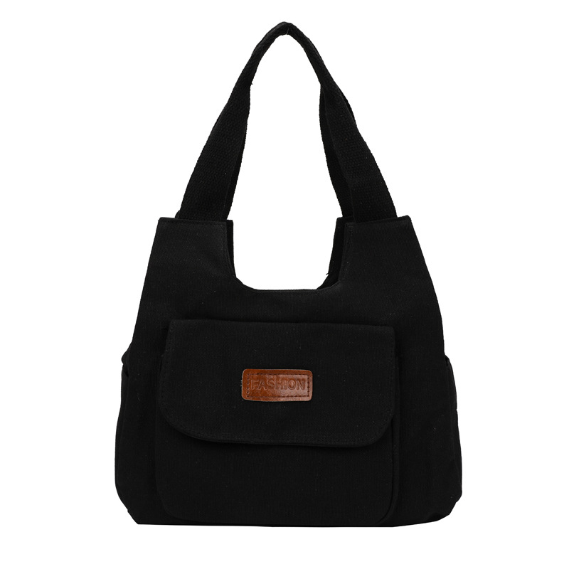 Bolsa de lona de gran capacidad para mujeres otoño-invierno 2024 nuevo estilo tideins viento brazalete bolsa de ocio estudiante bolsa de tote minimalista viento