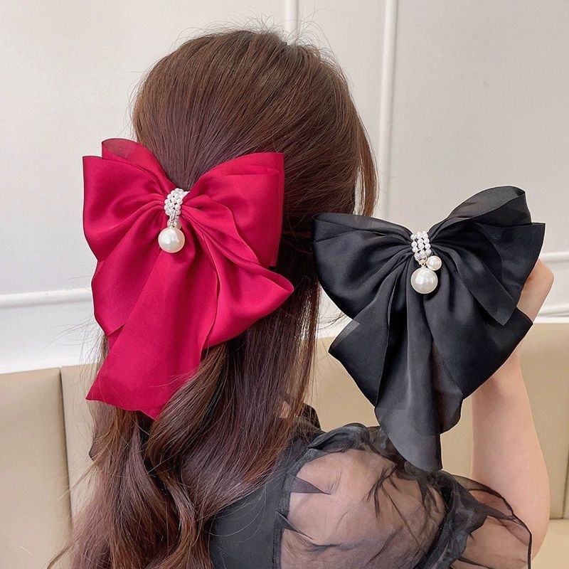 Solid color pearl pendant bow hairpin hair accessories High Sense back of the head Korean temperament spring clip top clip wholesale