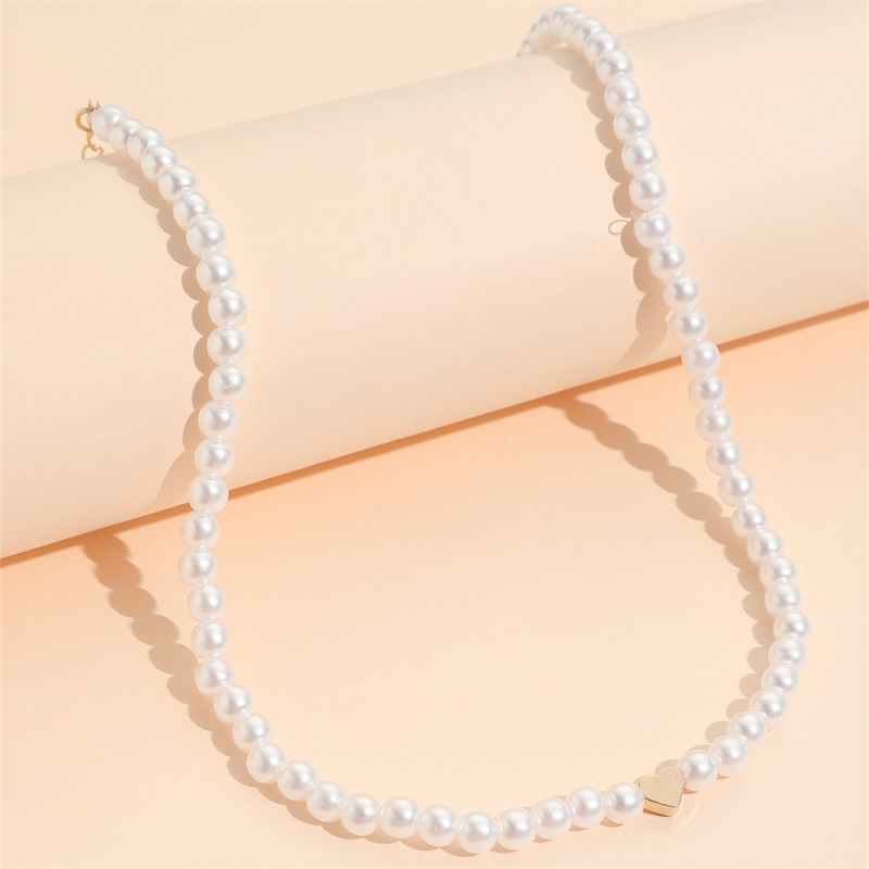 Collier élégant et raffiné, style Ins Style Niche Pearl, pour femme. Pendentif cœur ajouré, chaîne ras du cou légère et luxueuse._voghion.com