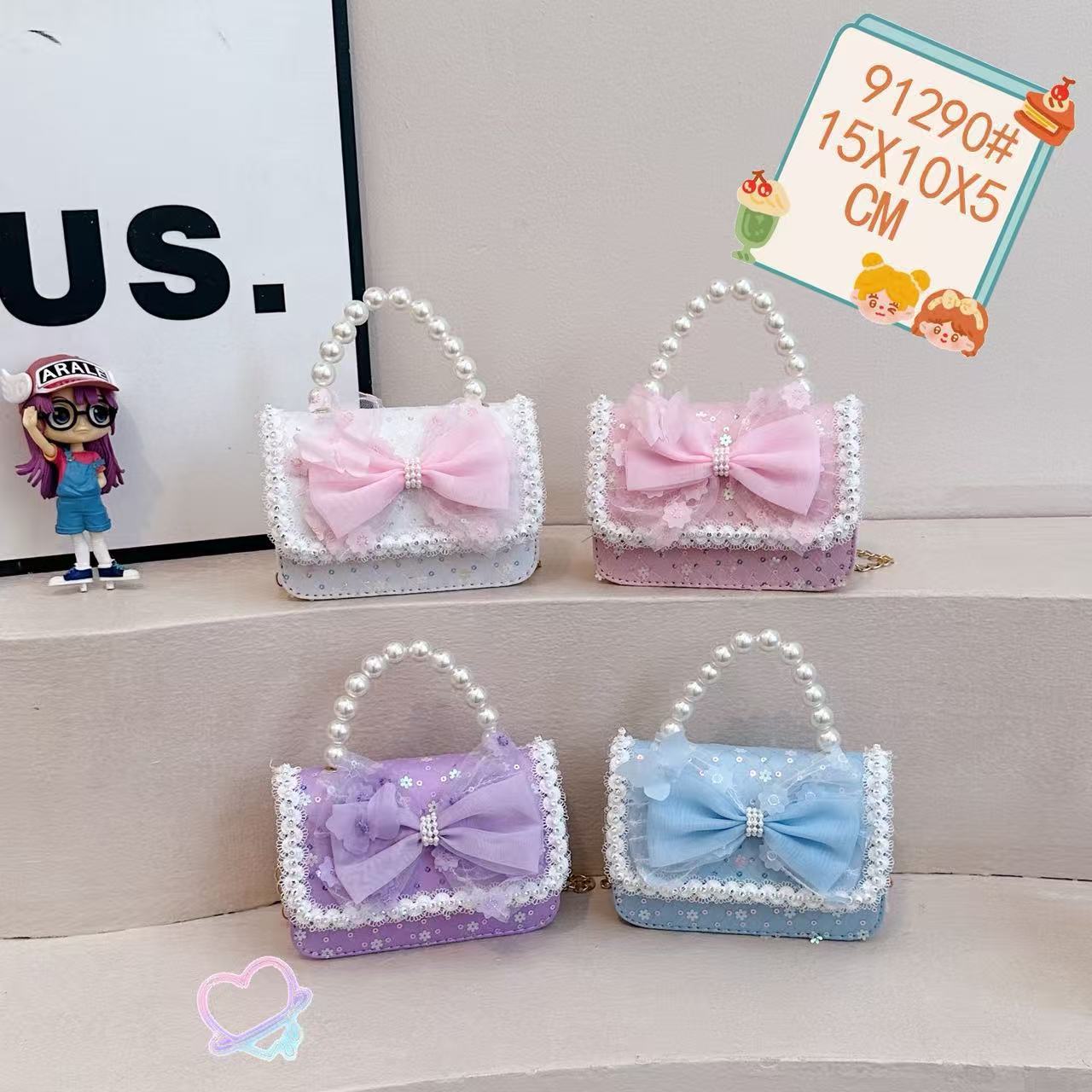 Nuevo comercio exterior pequeña fragancia niñas hombro mochila de moda perla arco bolsos de niños bolsos de cambio de dibujos animados